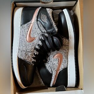 Nike Air Jordan Retro High black and grey fleece with rose gold accents.